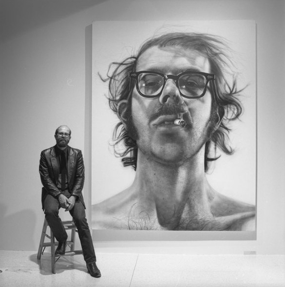 Chuck Close with self portrait